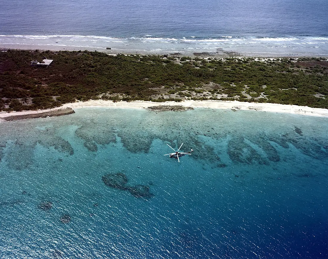 Sikorsky SH-3G Sea King from Helicopter Combat Support Squadron 1 in flight during an aerial radiation survey over Bikini Atoll in November 1978
