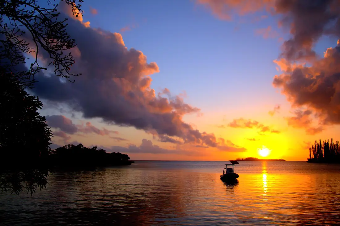 An Yellow Sunset over Isle of Pines in New Caledonia