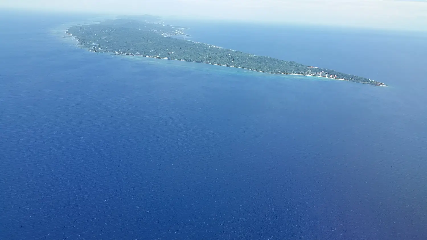 Roatan looking northwest with West Bay on the right and Coxen Hole and Manuel Galvez airport in the upper middle