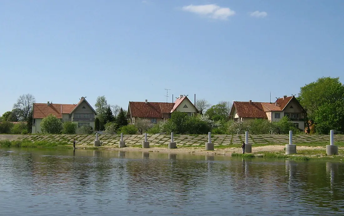 Near the shore houses (1C, 1B, 1A) at Neringos Gatvė street left from Atmata river beach, Rusnė, Lithuania, 40 meters off the shore view from Rusne territorial waters at Skirvytė river, spring, 2007