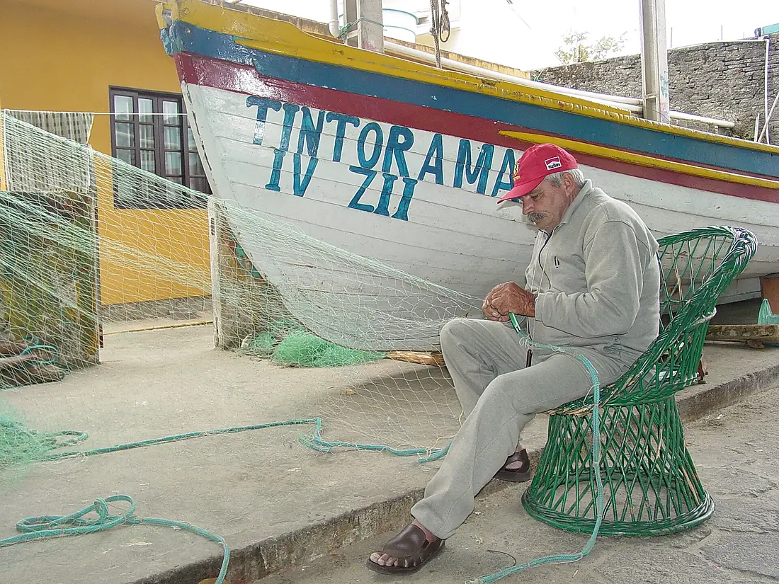 Fisherman Repairs His Nets - Armacao - Santa Catarina Island - Brazil